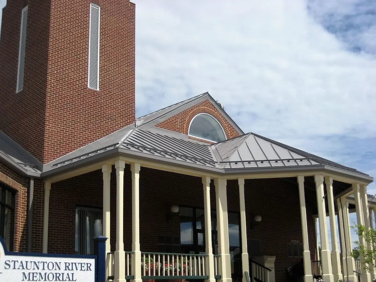 Skilled roofing craftsmen working on a residential roof in Galeville